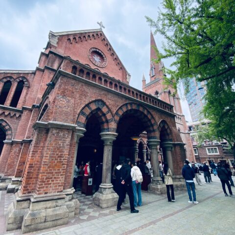 People standing outside a church.